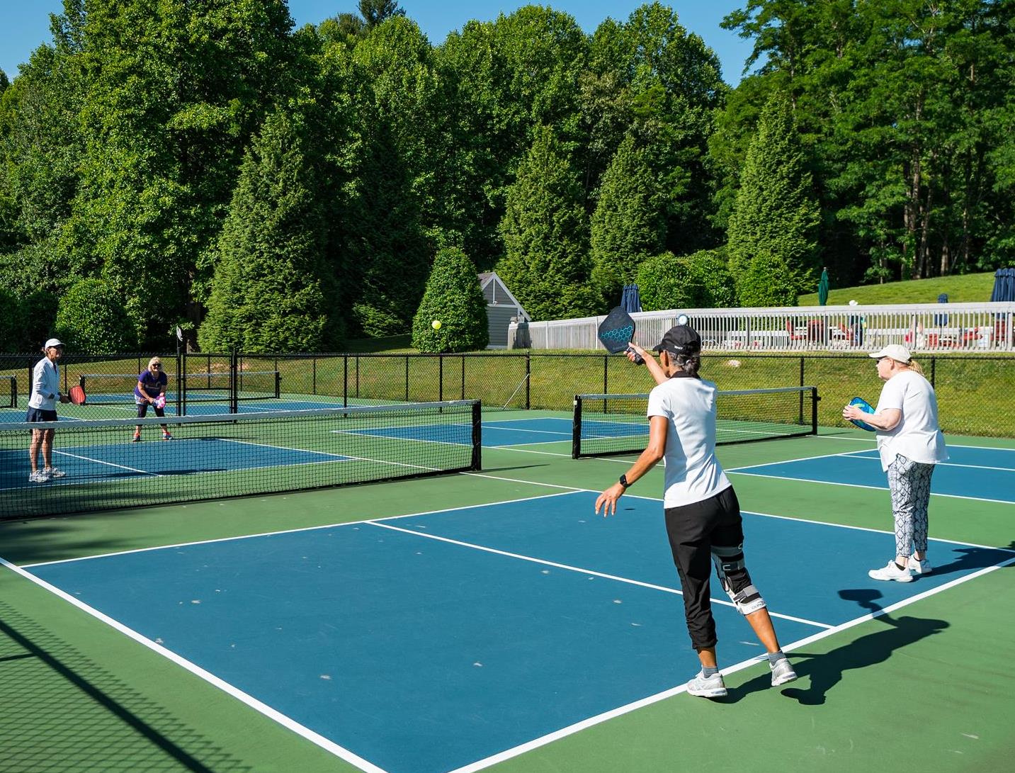 Friends enjoying a game of peakball at Kenmure Country Club