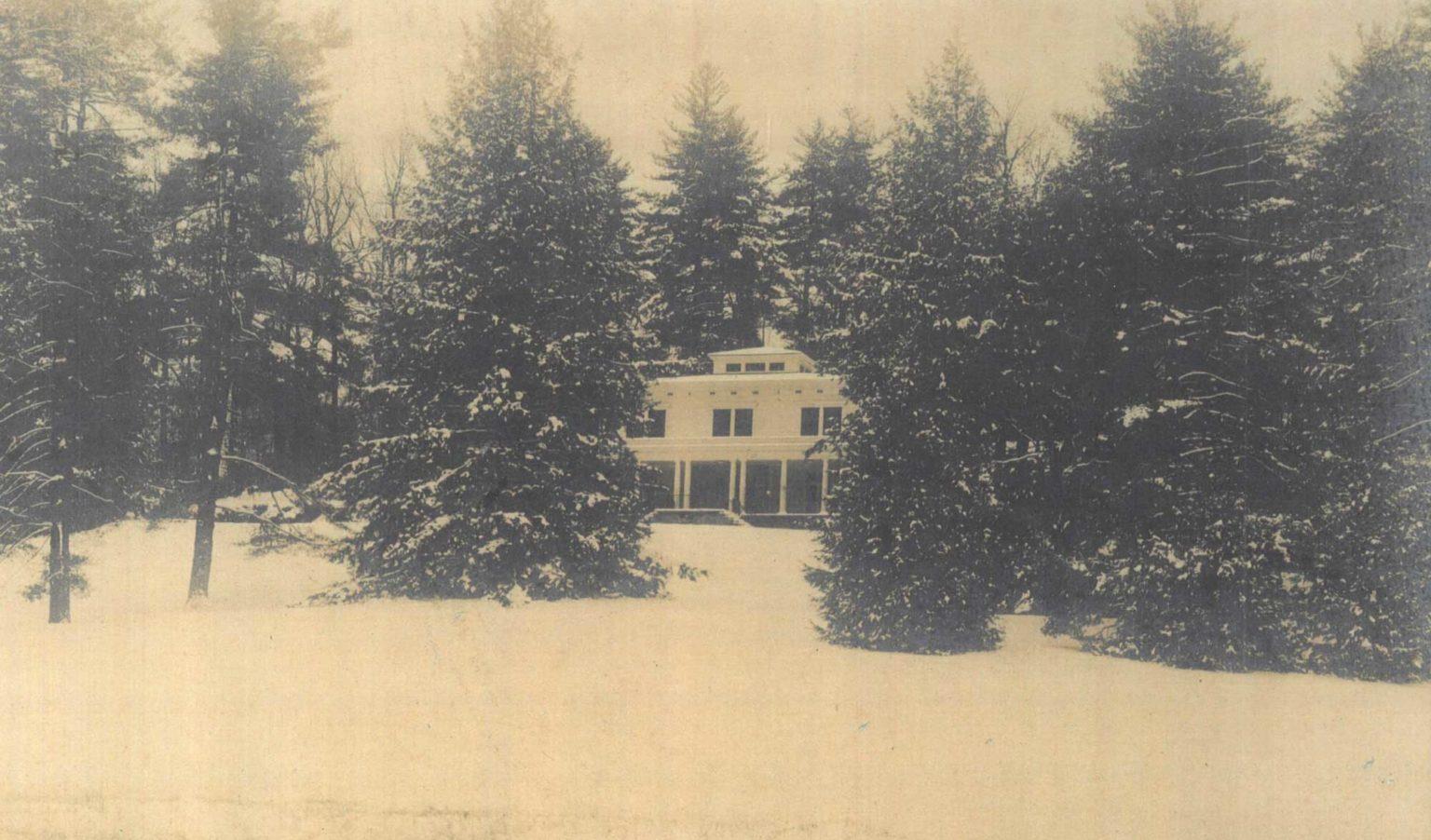 Sepia-toned photo of an old house surrounded by trees, reflecting the rich history of Kenmure