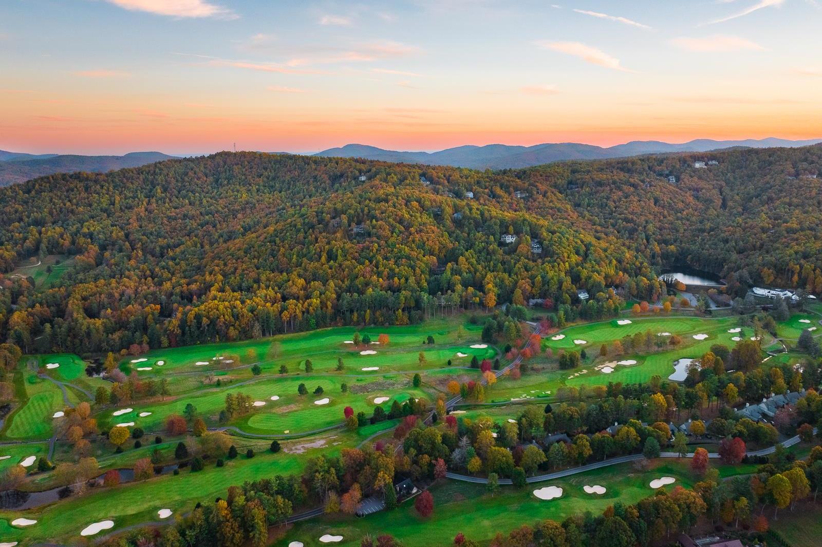 Aerial view of Kenmure Country Club, showcasing 1,400 acres of rolling hills, lakes, and forests