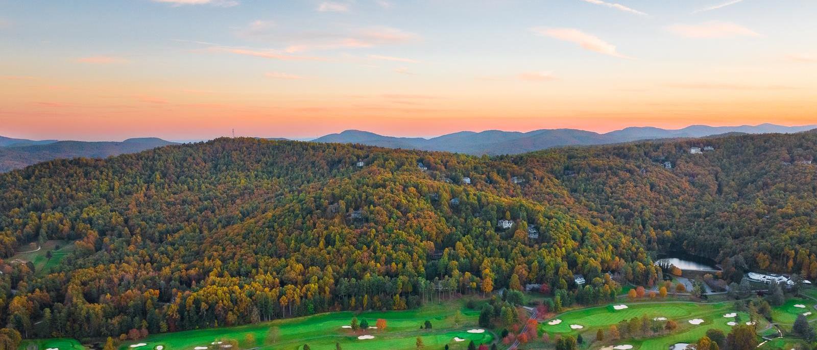 Aerial view of Kenmure Country Club, showcasing 1,400 acres of rolling hills, lakes, and forests