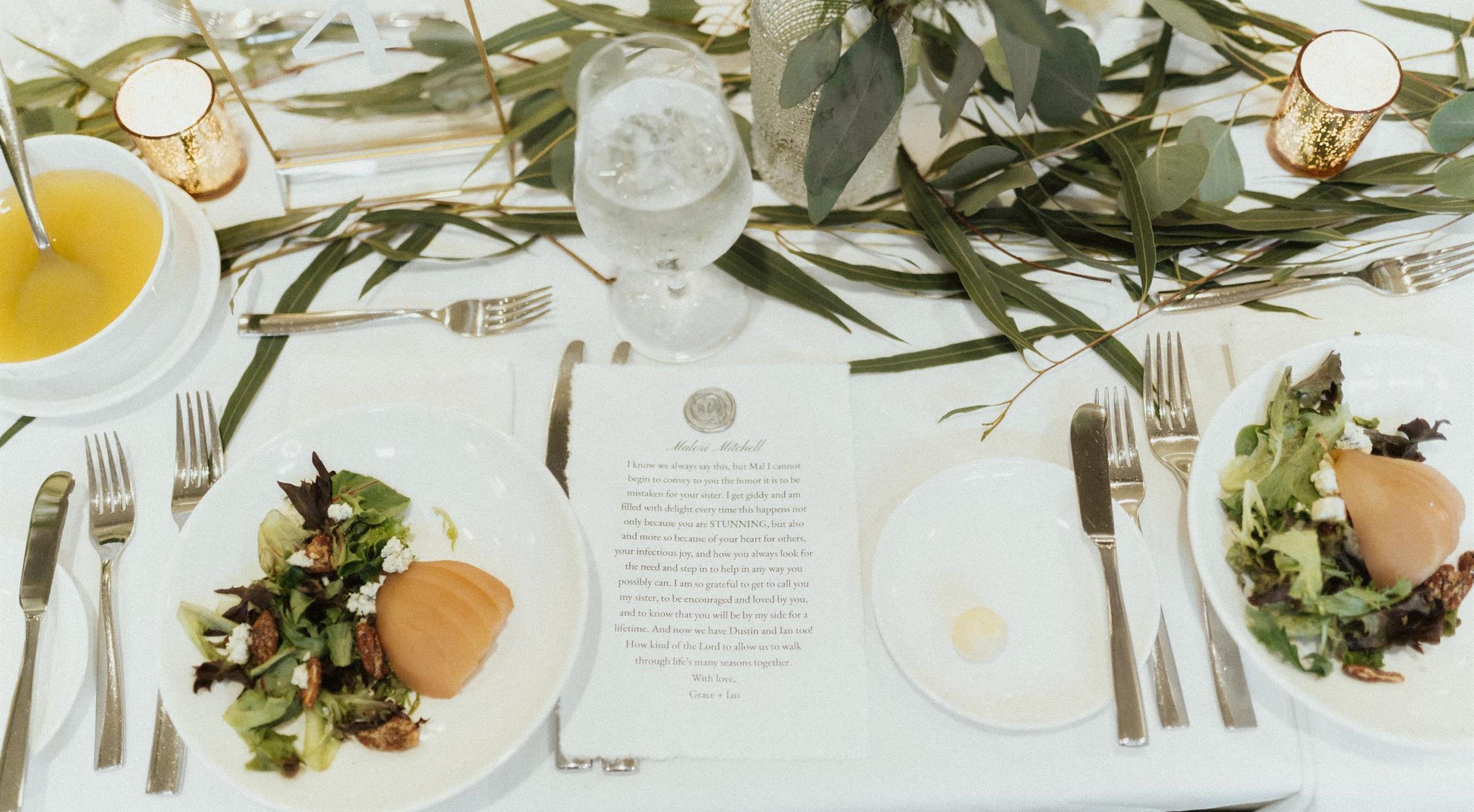 ining table with a menu and dishes, expertly arranged and taken care of by the staff at Kenmure