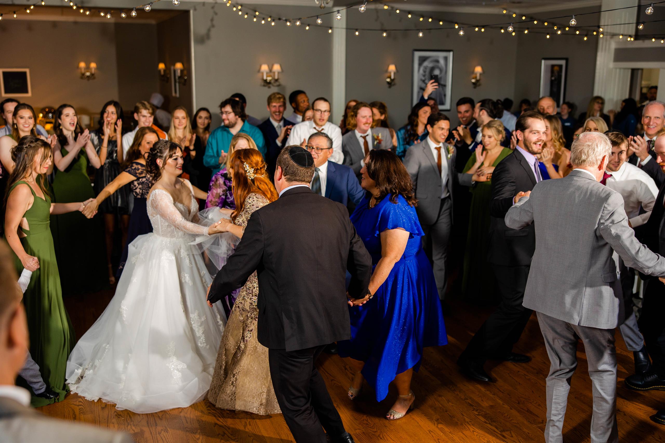 Guests dancing at a wedding reception in the Charleston Room venue at Kenmure.